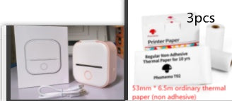White electronic device with packaging and printer paper rolls on a white background
