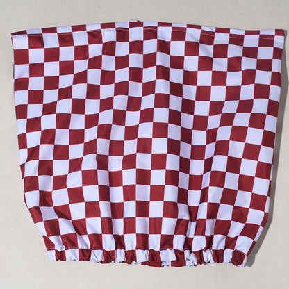 Red and white checkered fabric on a beige background