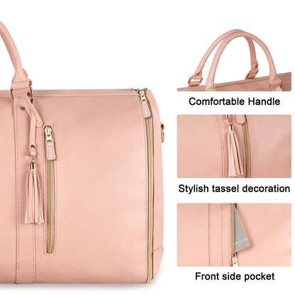 Pink duffel bag with handle, tassel decoration, and front side pocket on a white background.
