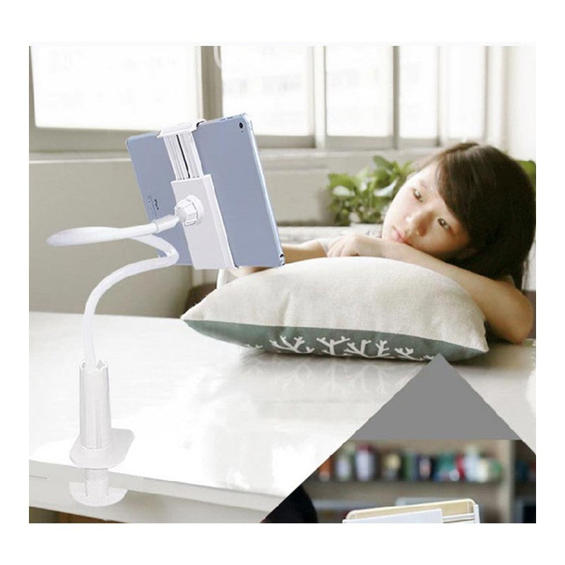 Child using a tablet stand on a desk with a tablet device
