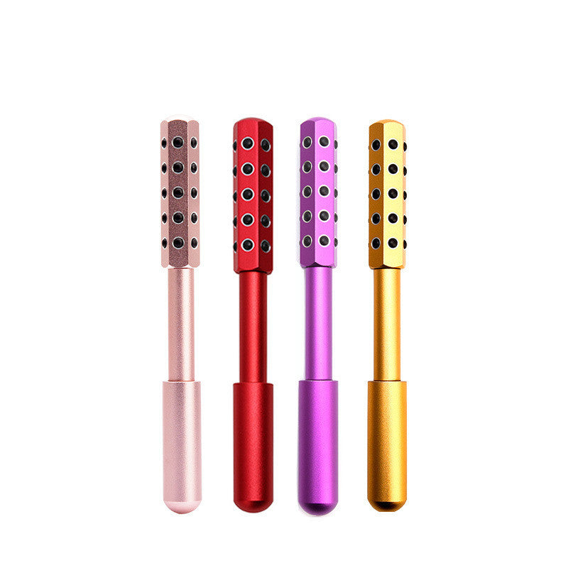 Four colorful metal tools with textured ends on a white background