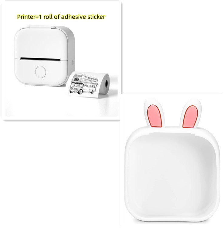 White printer with adhesive sticker roll and a white container with pink bunny ears on a white background.