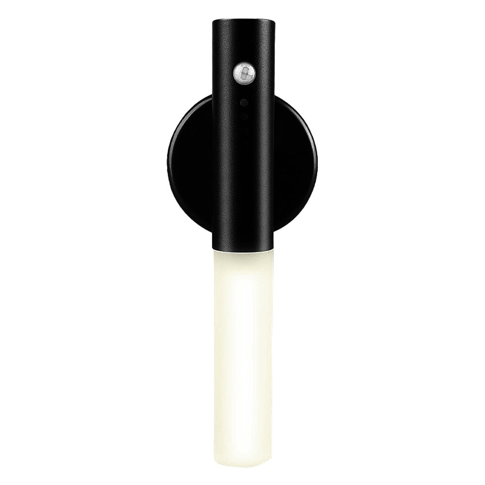 Black wall-mounted light fixture with a white bulb on a white background