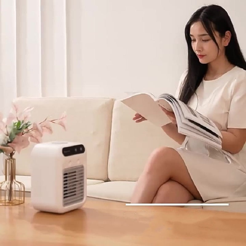 girl reading a book front of a air cooler