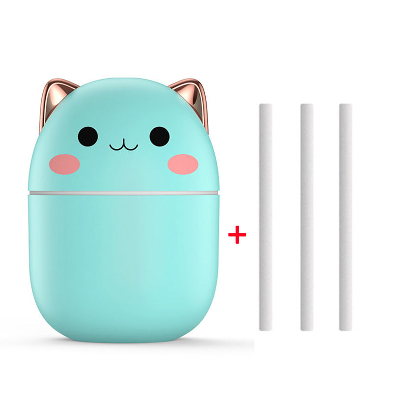Cute turquoise cat-shaped container with rose gold accents on a white background