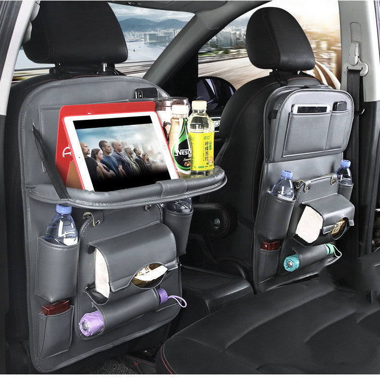 Car back seat organizer with tablet holder, drinks, and snacks in a vehicle.