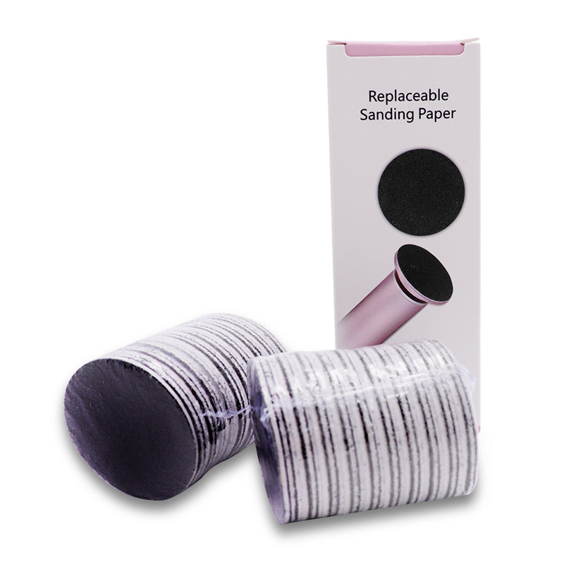 Electric foot callus remover device shown in pink color, alongside a visual depiction of its use on a foot, and a close-up of the device's head showing the replacement sandpaper.