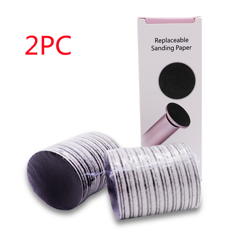 Electric foot callus remover device shown in pink color, alongside a visual depiction of its use on a foot, and a close-up of the device's head showing the replacement sandpaper.