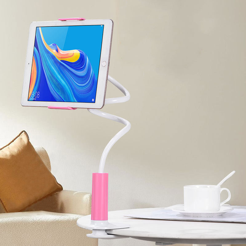 Tablet on a flexible stand with a colorful display, placed on a table next to a cup and saucer.