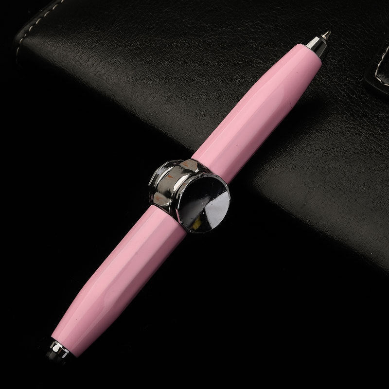 Pink pen with a silver cap on a black background
