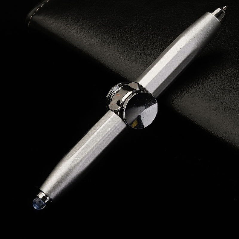 Silver pen with a black cap on a dark background