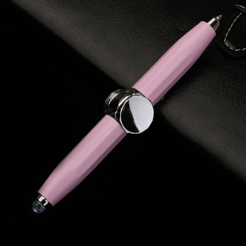 Pink pen with silver accents on a black background