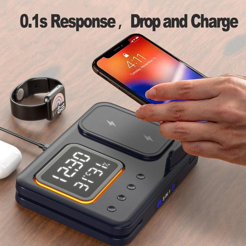 Multi-device wireless charging station with smartphone, smartwatch, and wireless earbuds on a wooden surface.