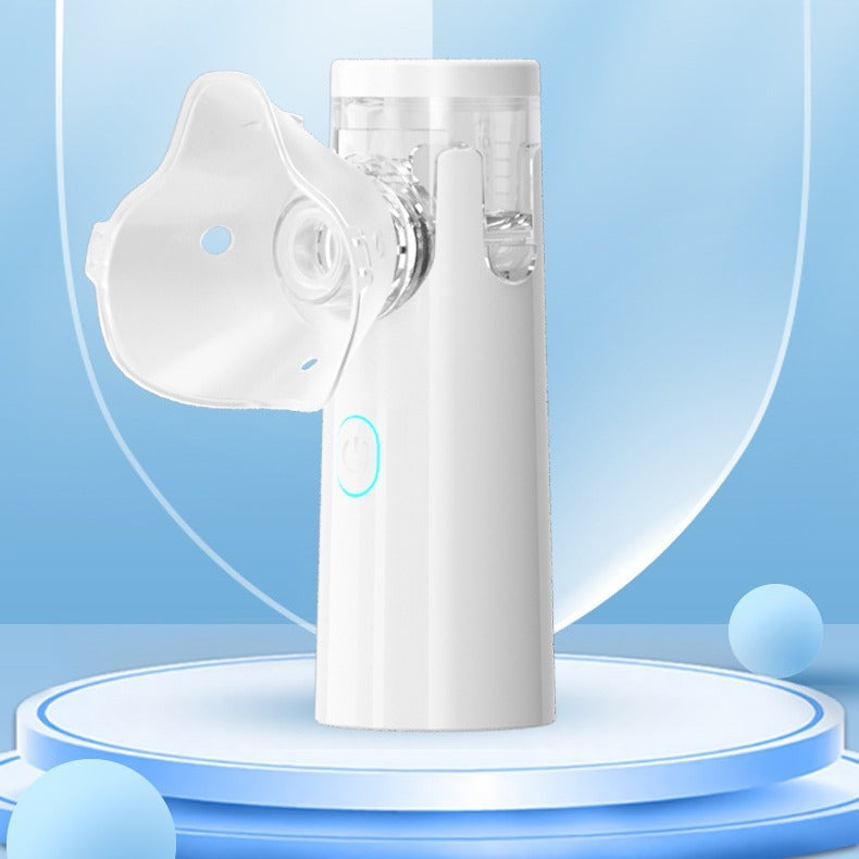 A handheld ultrasonic nebulizer designed for children, showing the device, a mask, and a nebulized bite, against a blue background.