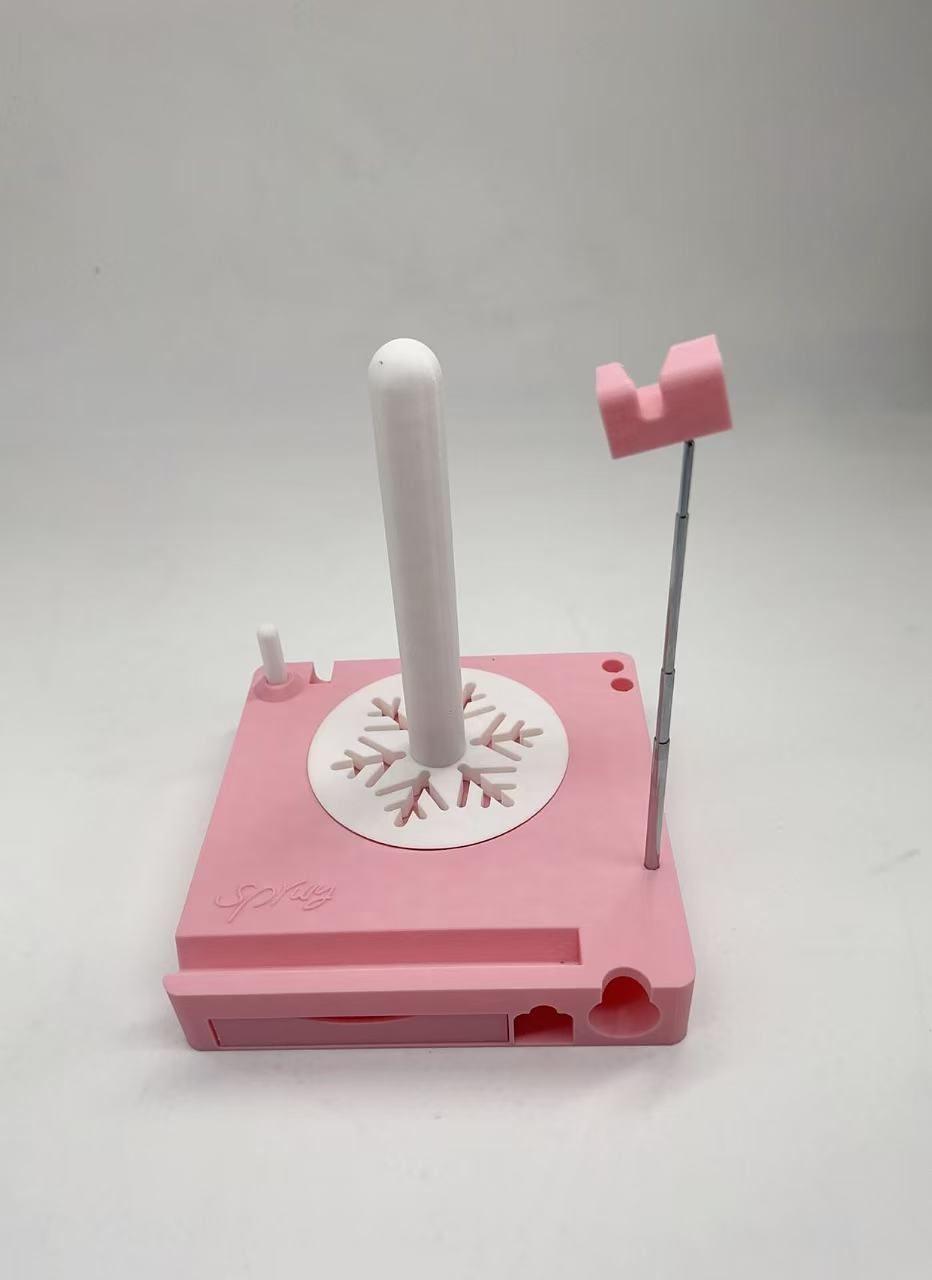 Pink stationery holder with a pen on a white background