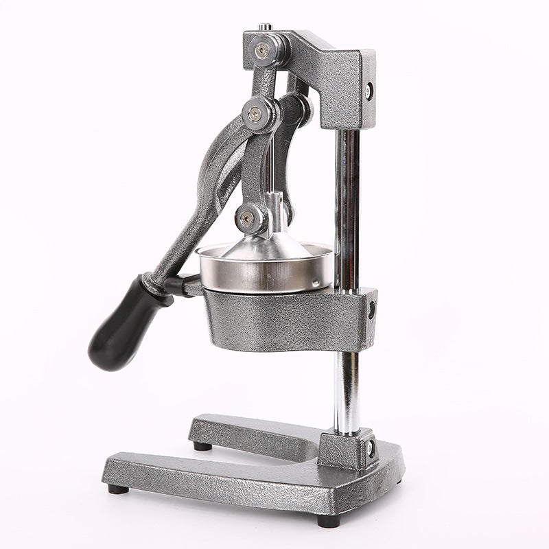 Metallic manual juicer on a white background