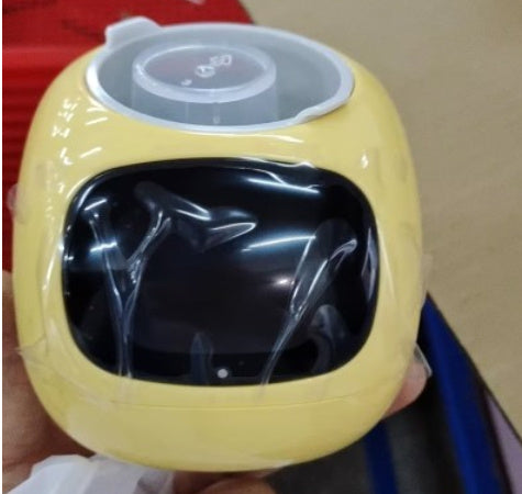 Yellow electronic device with a black screen held in a hand against a neutral background