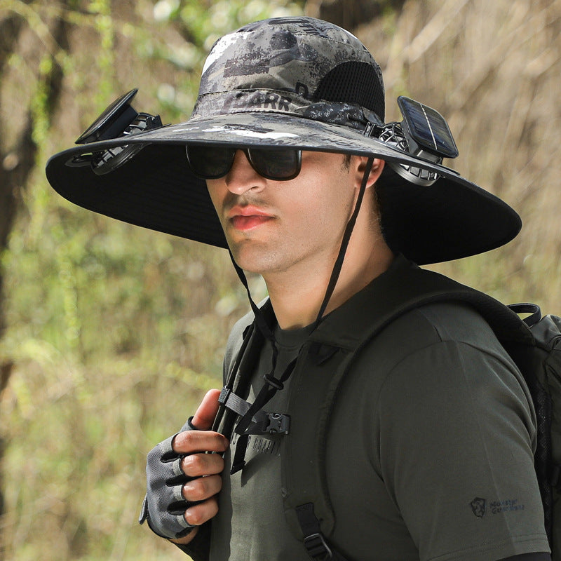 Person wearing a wide-brimmed camouflage hat with a backpack in a forest setting