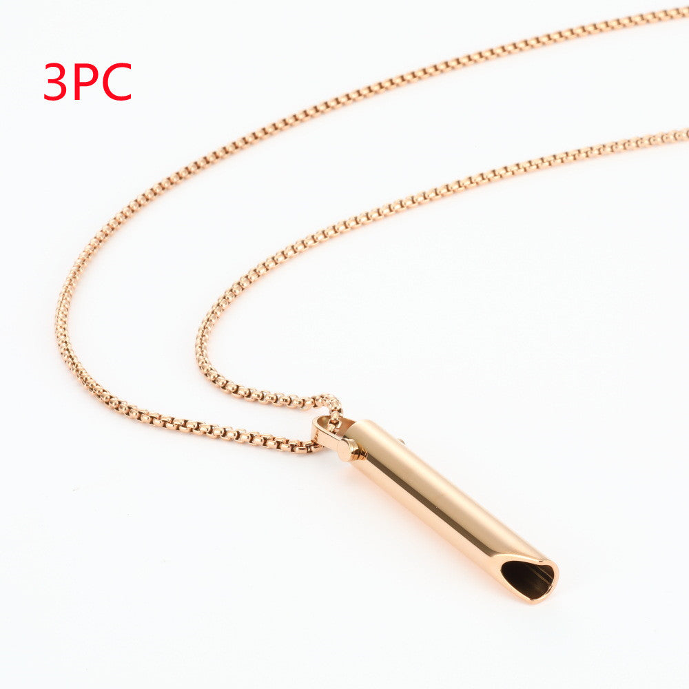 Rose gold necklace with a cylindrical pendant on a white background