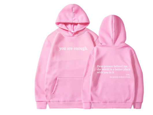 Pink hoodie with motivational text on a white background