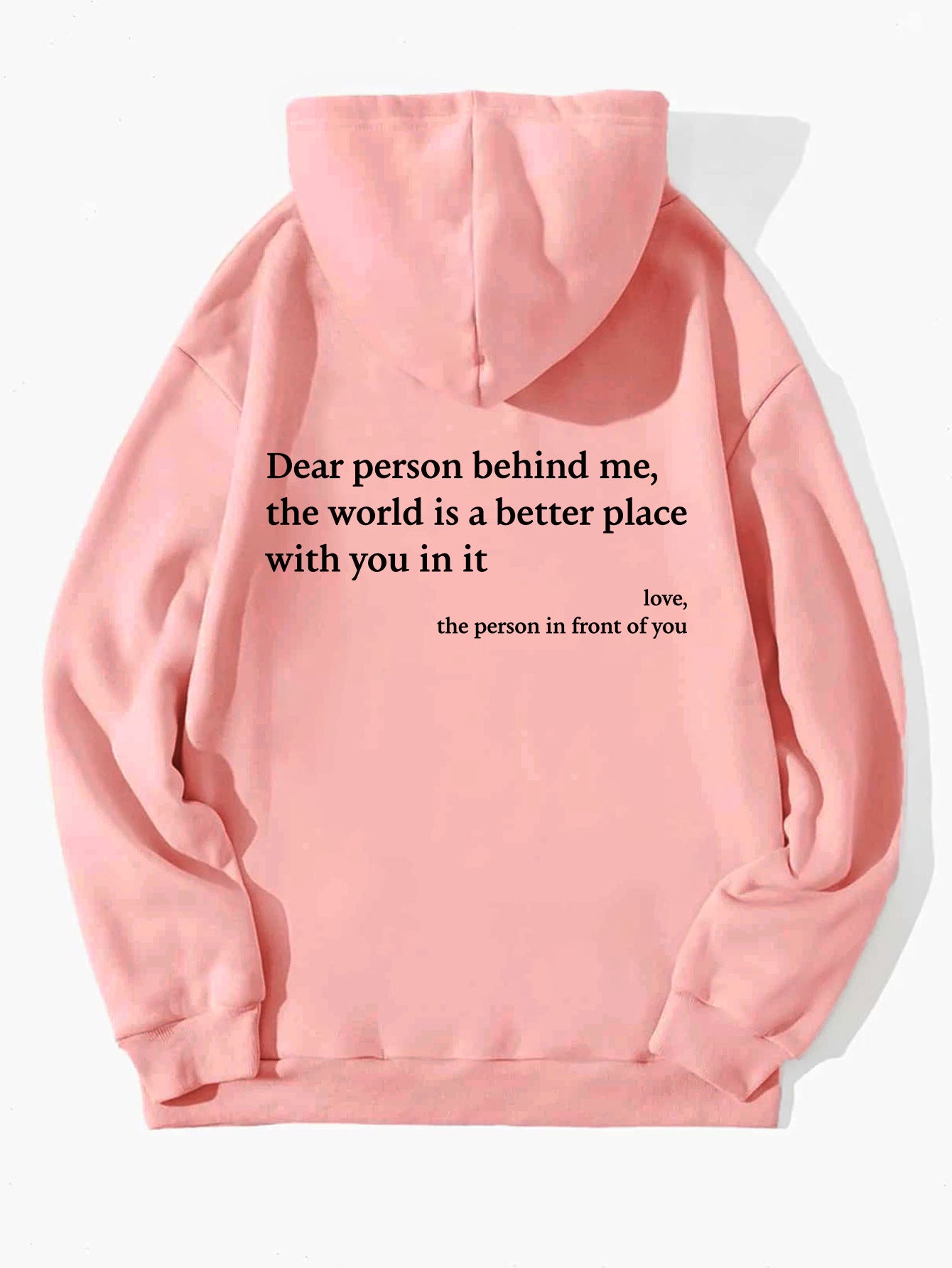 Pink hoodie with a motivational quote on the back against a white background