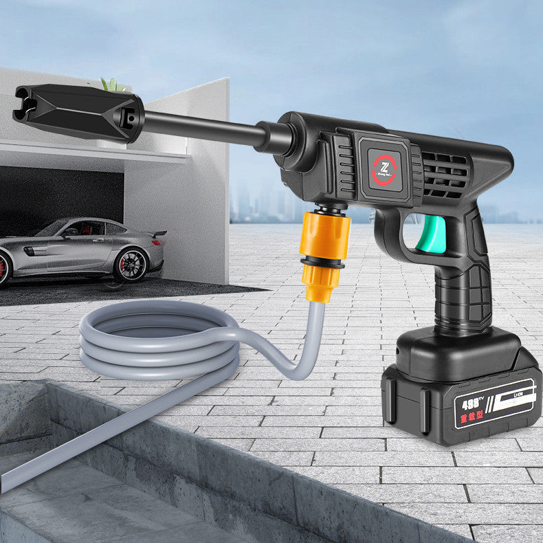 Electric pressure washer with hose on a background of a car and garage.
