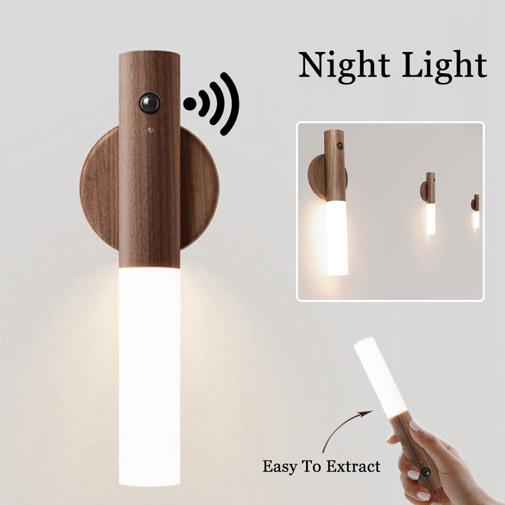 Wooden wall-mounted night light with a hand holding a remote control, on a light gray background.