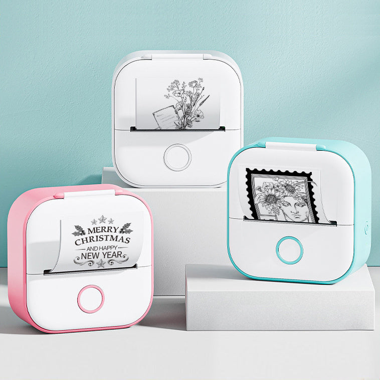 Two small printers, one pink and one blue, with printed designs on a light blue background.