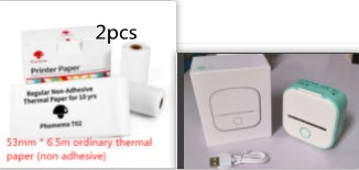 Two rolls of printer paper and a small electronic device on a white background.