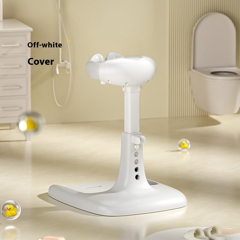 White shower head holder on a bathroom floor with a toilet in the background