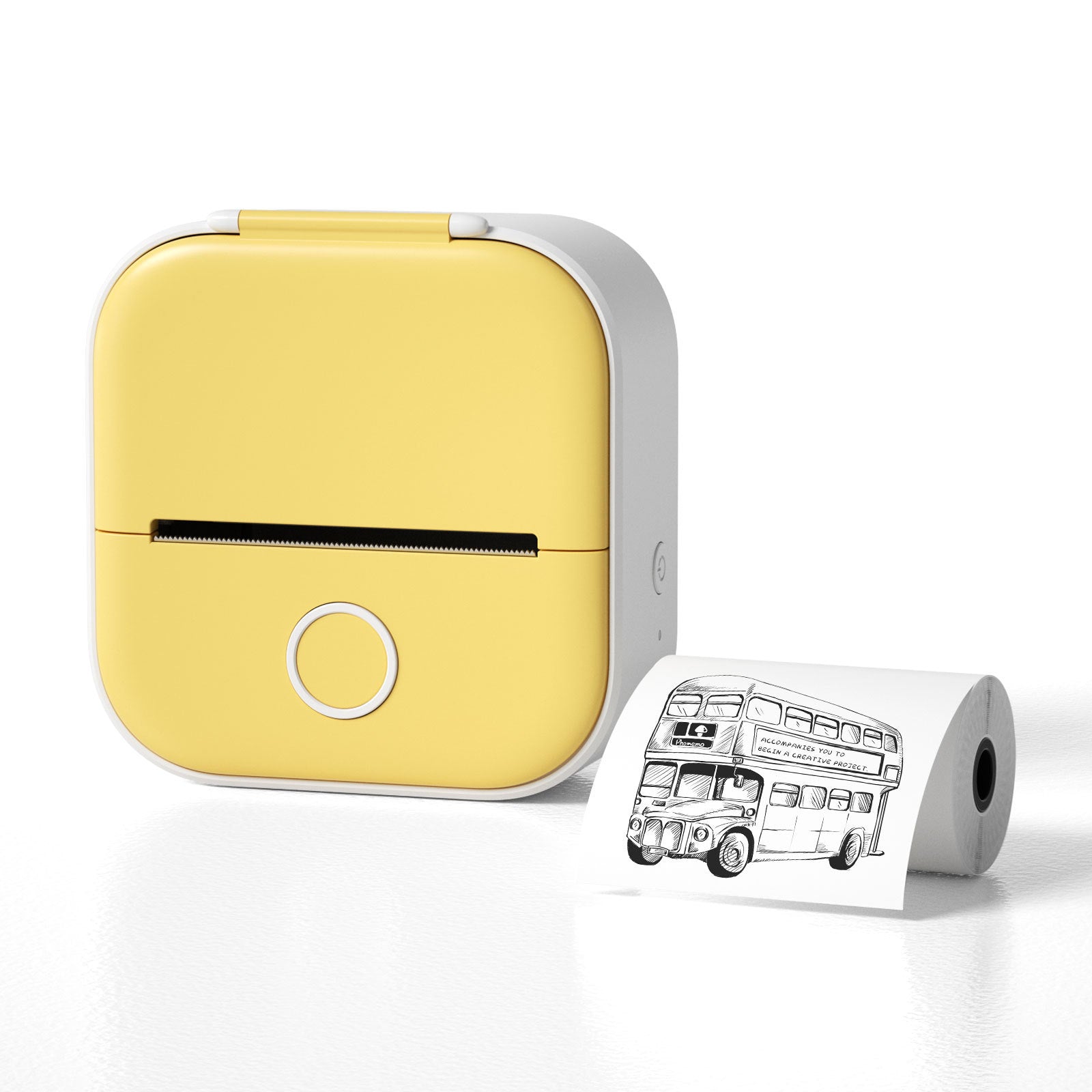 Yellow portable printer with a roll of paper featuring a black and white illustration of a London bus on a white background
