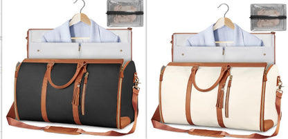 Black and white travel bags with hangers and shirts on a white background
