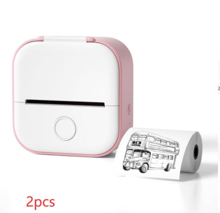 White and pink portable printer with a roll of paper featuring a bus design on a white background.