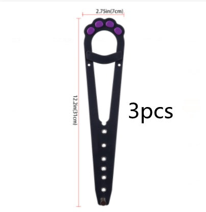 A pet cat door holder latch with a keyhole, shown in black with purple details, installed on a white door, with a cat looking at a dog through the door.