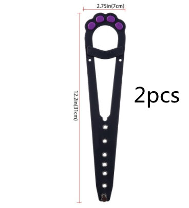 A pet cat door holder latch with a keyhole, shown in black with purple details, installed on a white door, with a cat looking at a dog through the door.