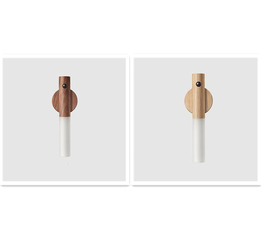 Two wooden pepper grinders on a white background